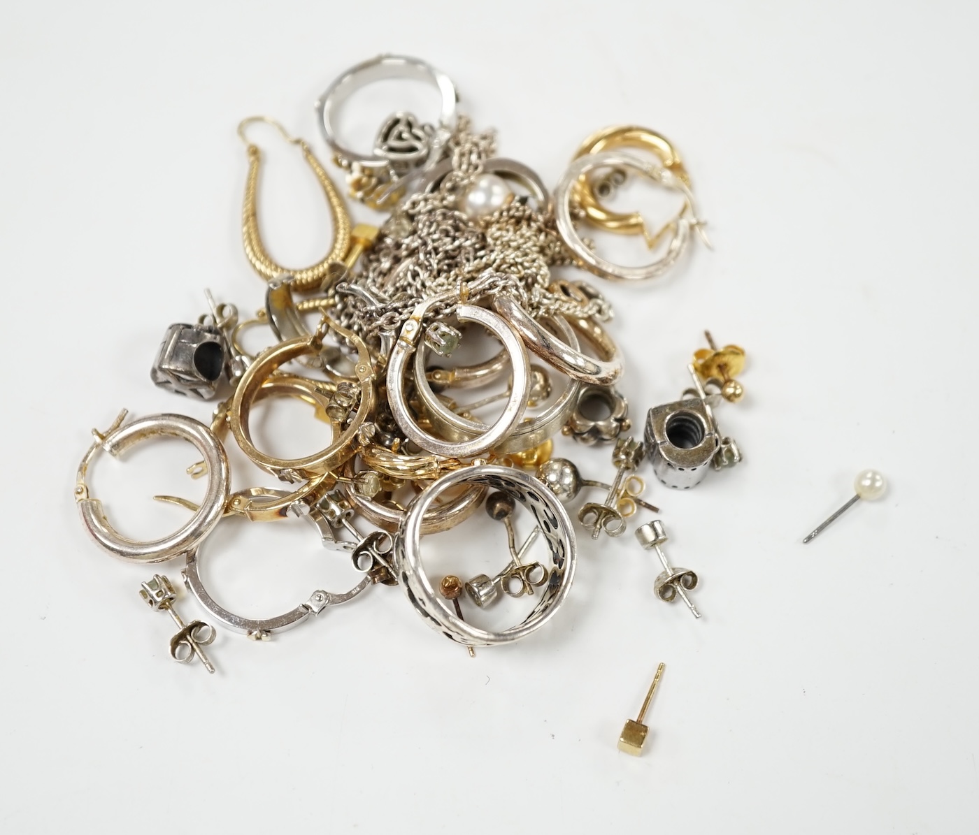 Four assorted pairs of modern 9k earrings, a 9ct white gold band, gross 10.8 grams and a small quantity of 925 jewellery. Condition - poor to fair